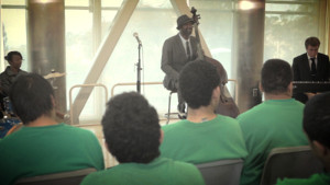 Photo of Marcus Shelby performing for inmates