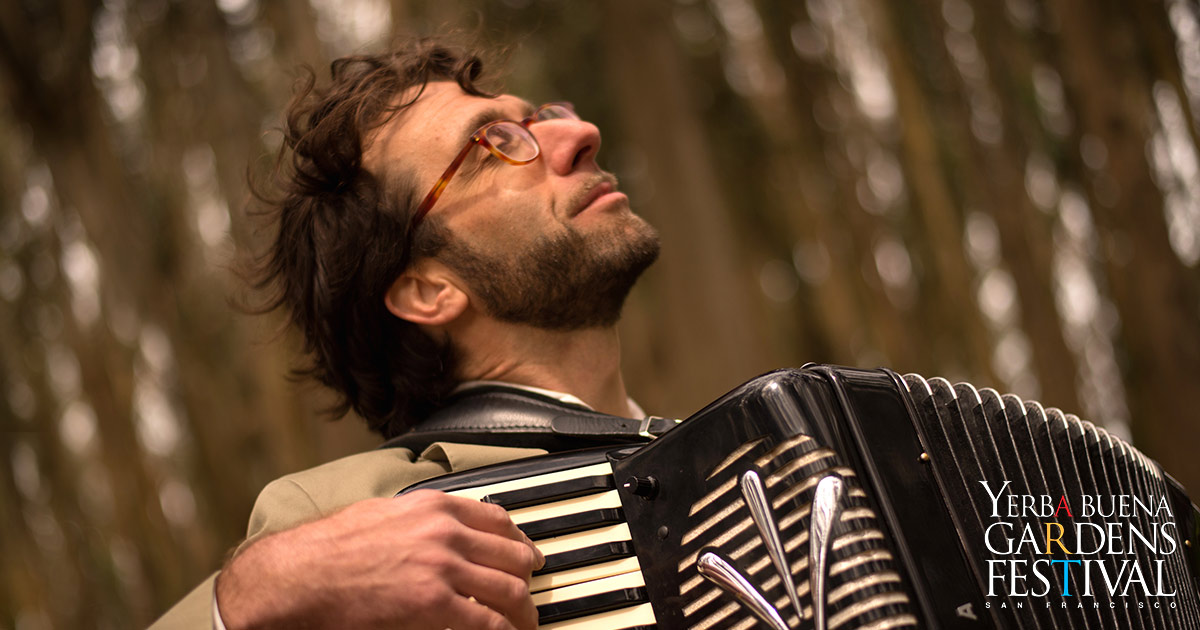 Photo of musician Rob Reich playing the accordion