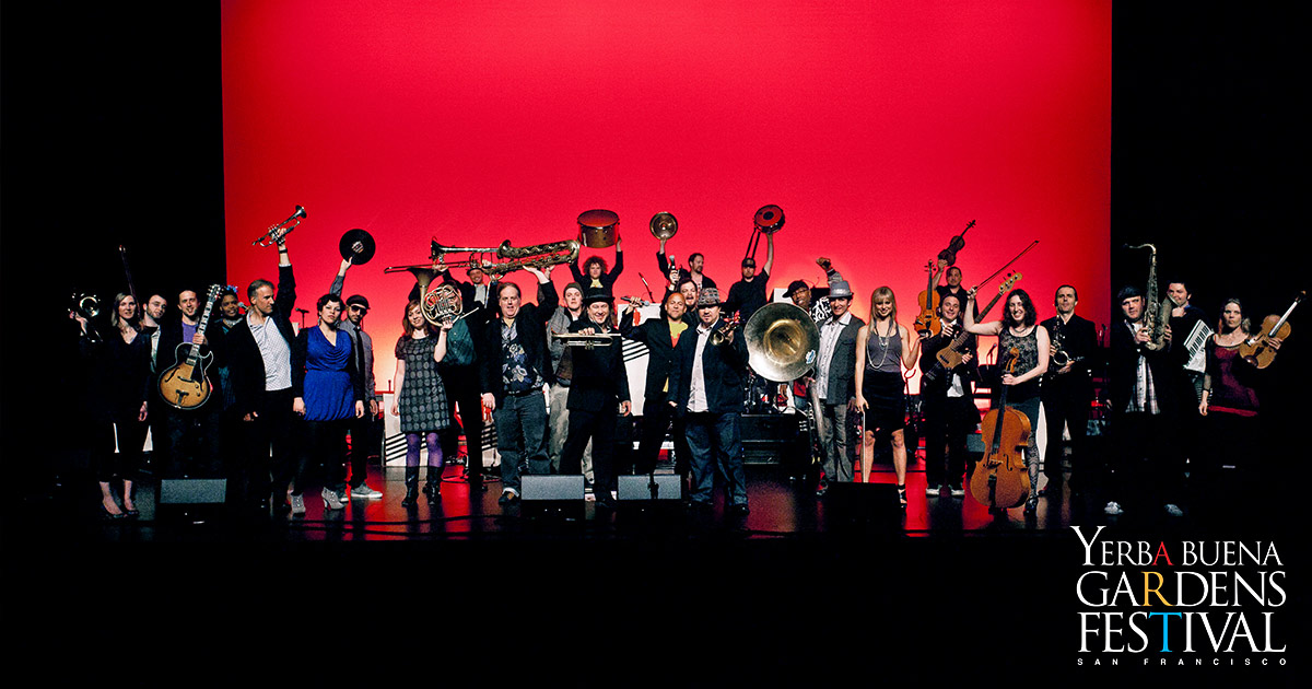 Photo of large group of musicians on stage for Brass, Bows and Beats