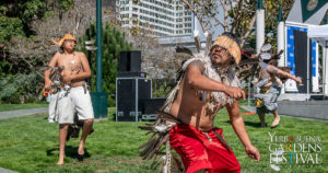 Photo of 3 male Pomo dancers performing outdoors. Photo by Jim Watkins Photography.