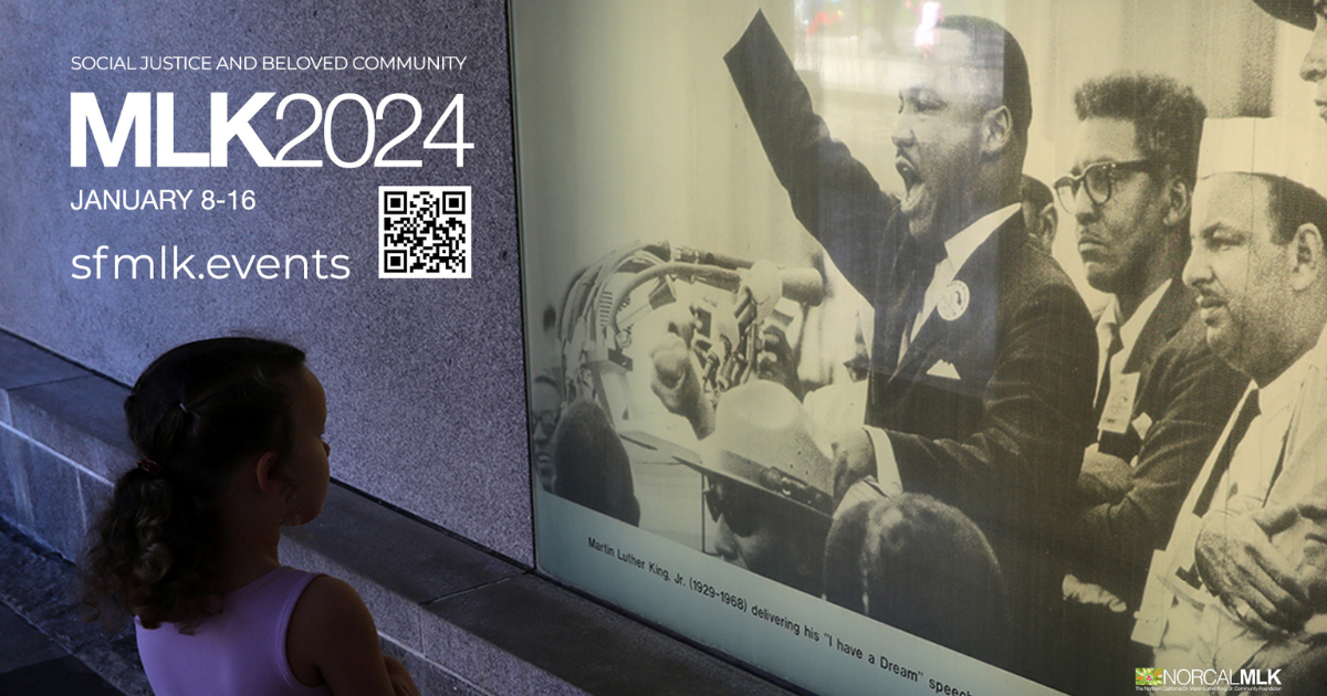 Photo of a child looking at large illuminated image of Dr. Martin Luther King Jr.