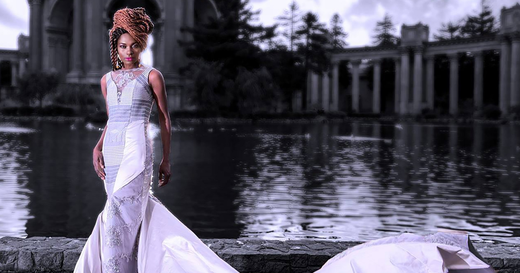 Fely in a white gown posing in front of the Palace of Fine Arts